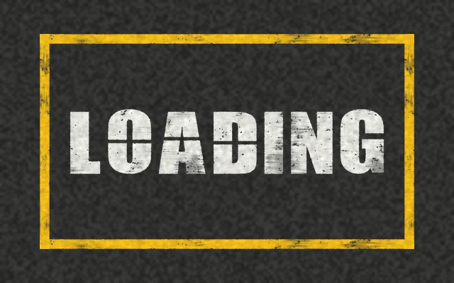 A yellow outlined box on asphalt with LOADING stenciled in white