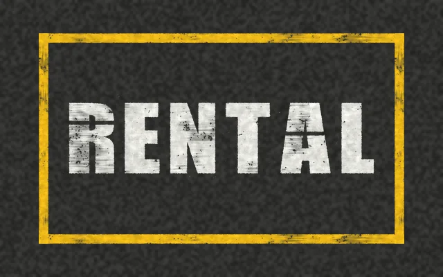 A yellow outlined box on asphalt with RENTAL stenciled in white