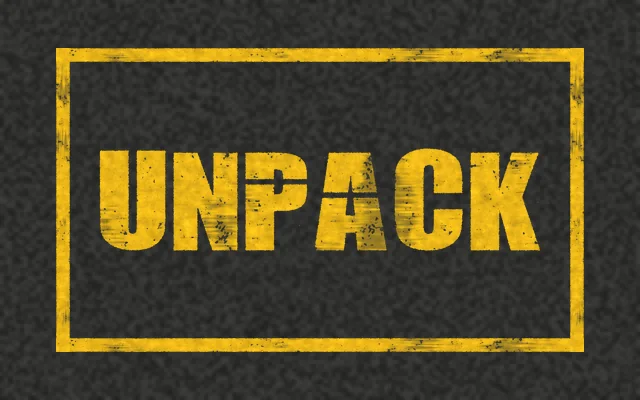 A yellow outlined box on asphalt with UNPACK stenciled in yellow