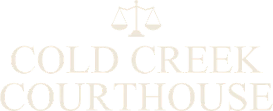 The Cold Creek Courthouse emblem: scales of justice